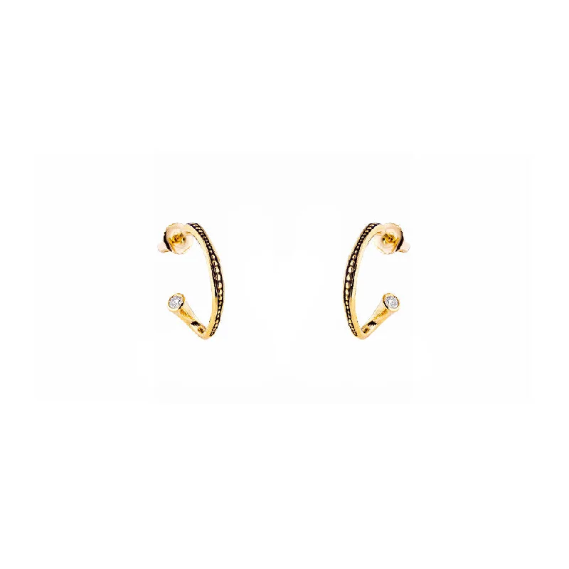 18 karat yellow gold Twist hoop earrings with diamonds